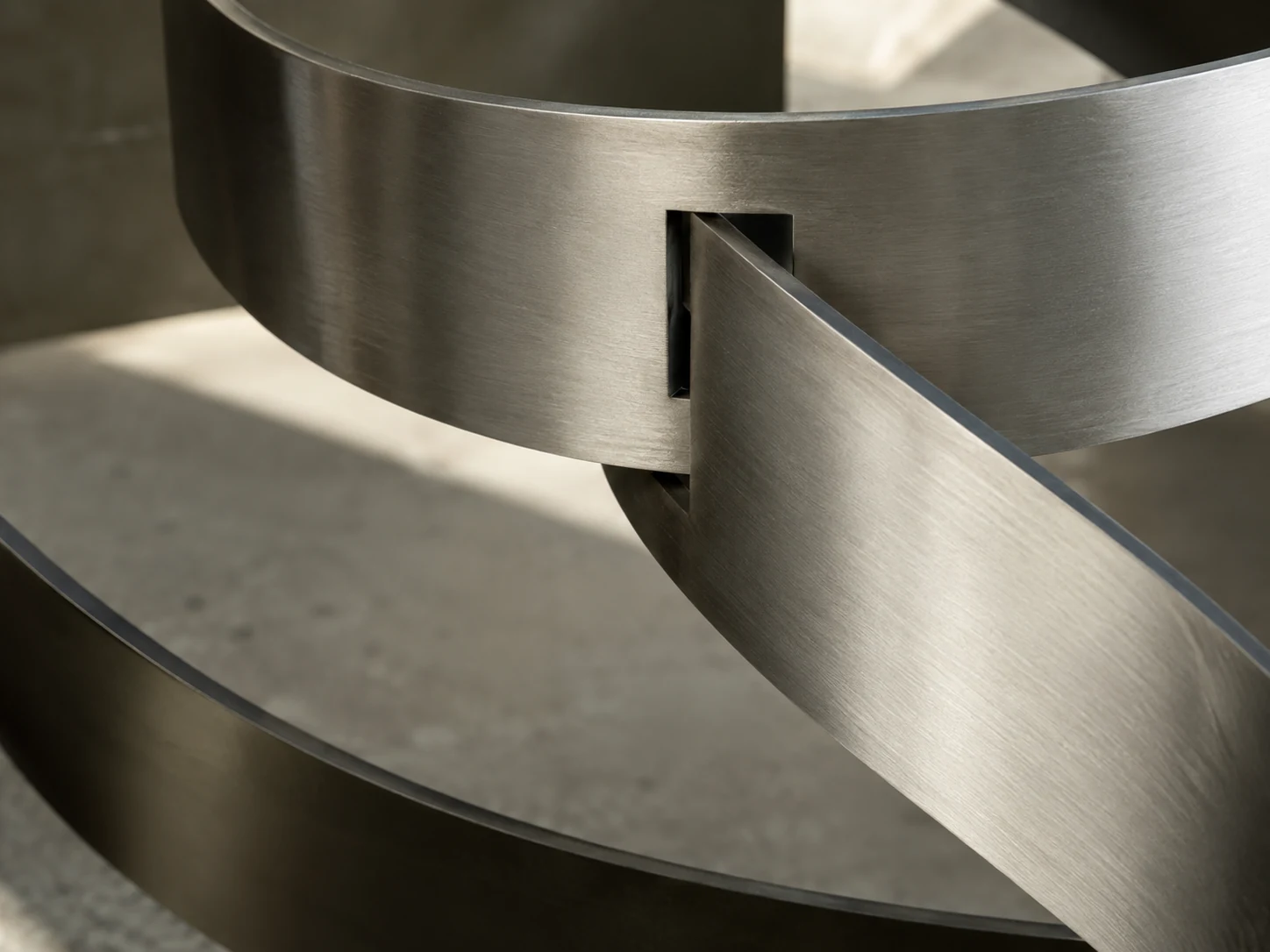 Close detail of precisely joined brushed-metal elements